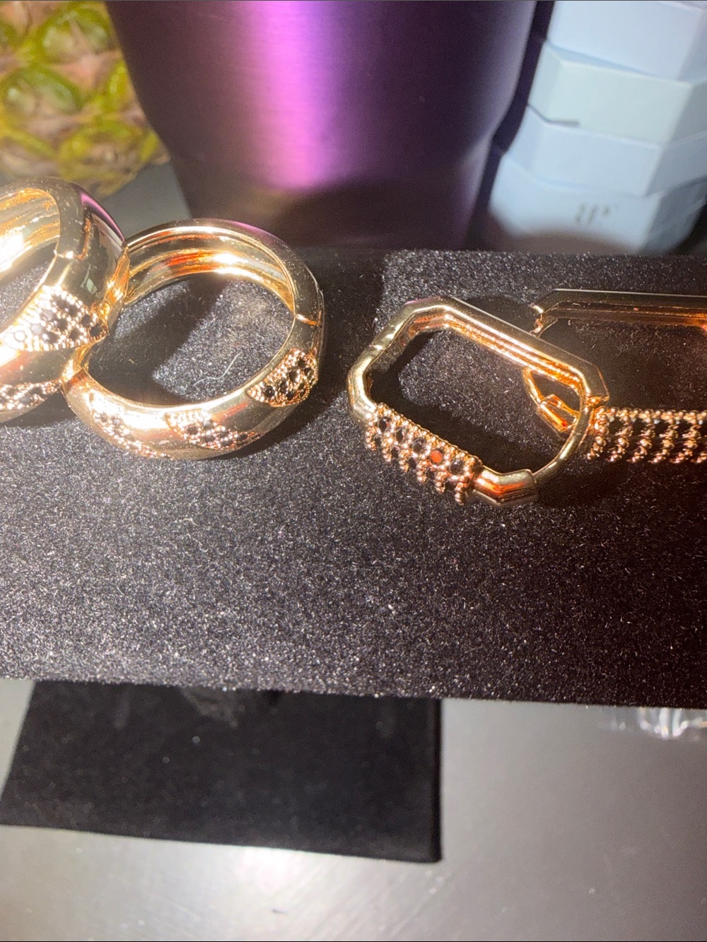 Gold-Tone two pairs of gold hoops with black accent stone